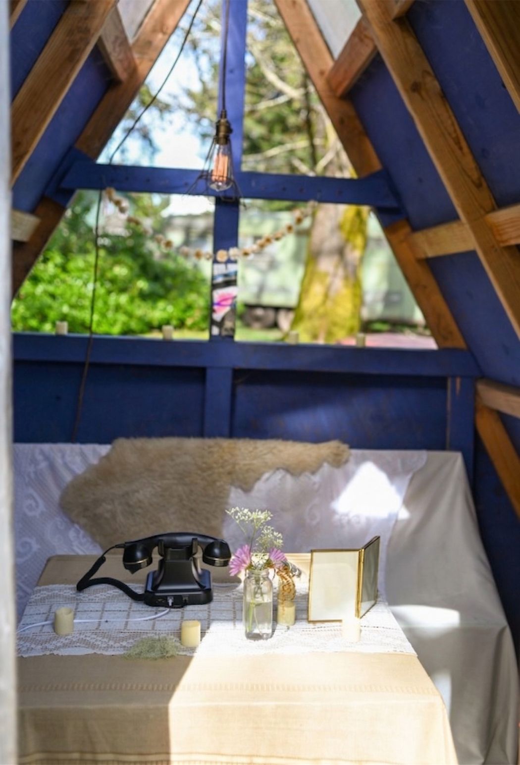 the rotary phone waiting in the blue a-frame cabin