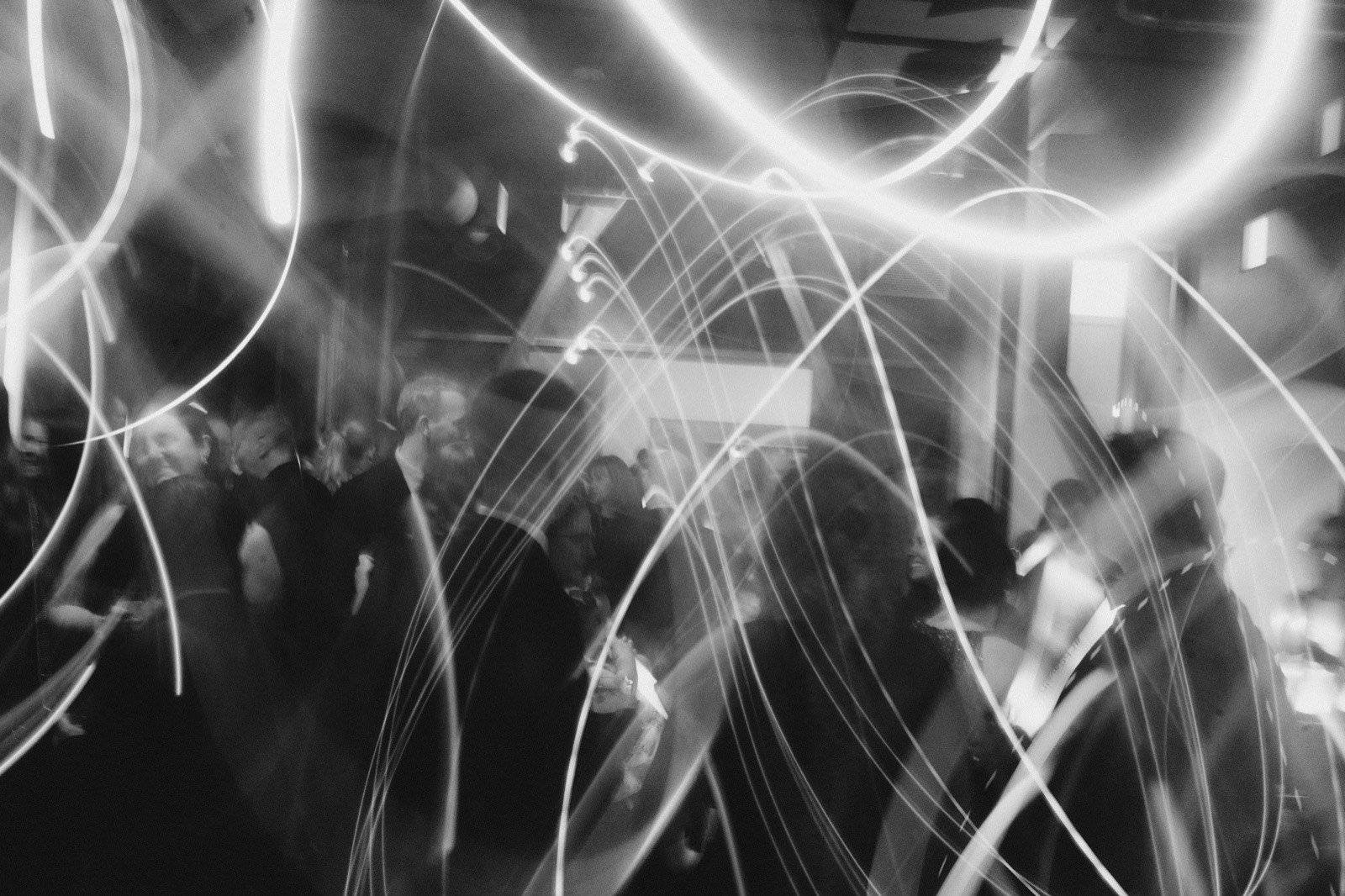 light beams over the crowd on the dance floor