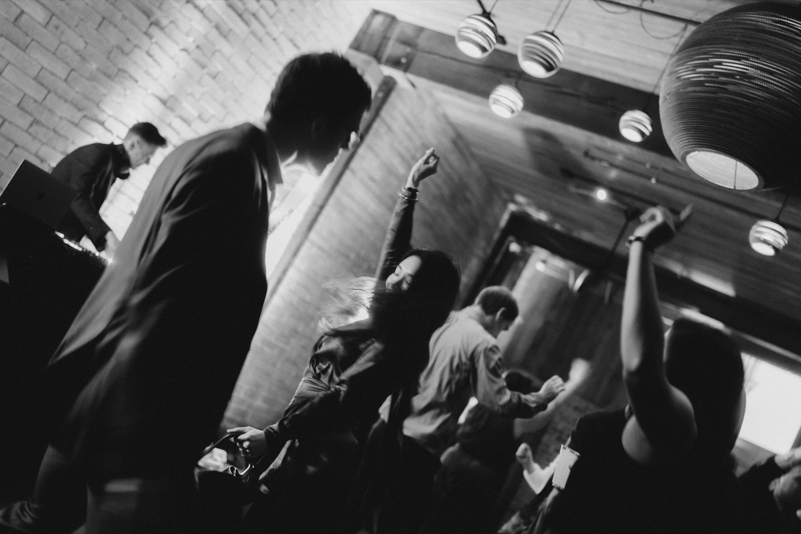 guests in silhouette against amber light