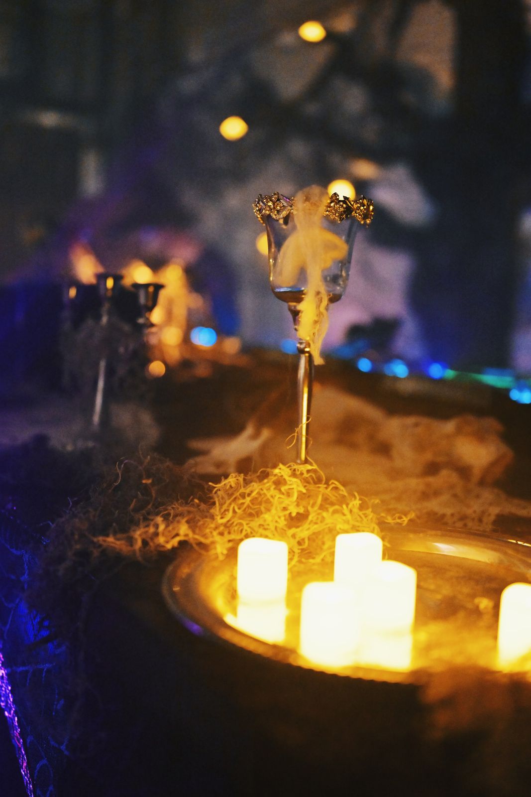 candelabra in warm and blue light with fog