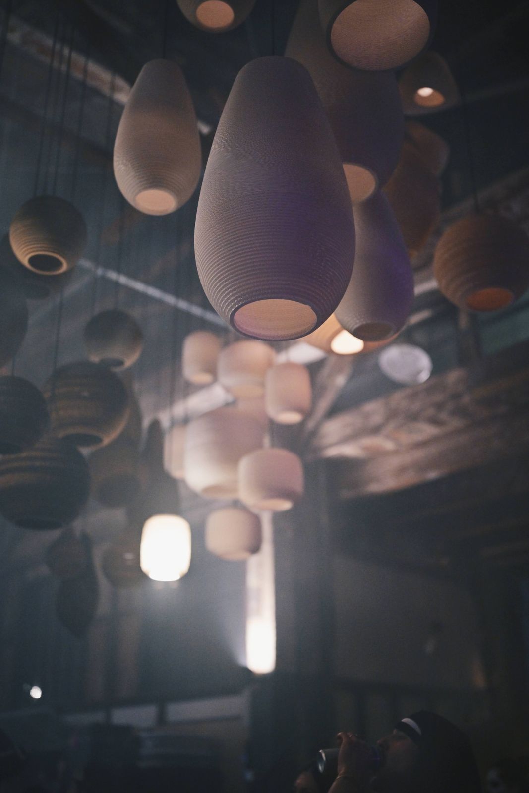 glowing overhead lanterns in haze