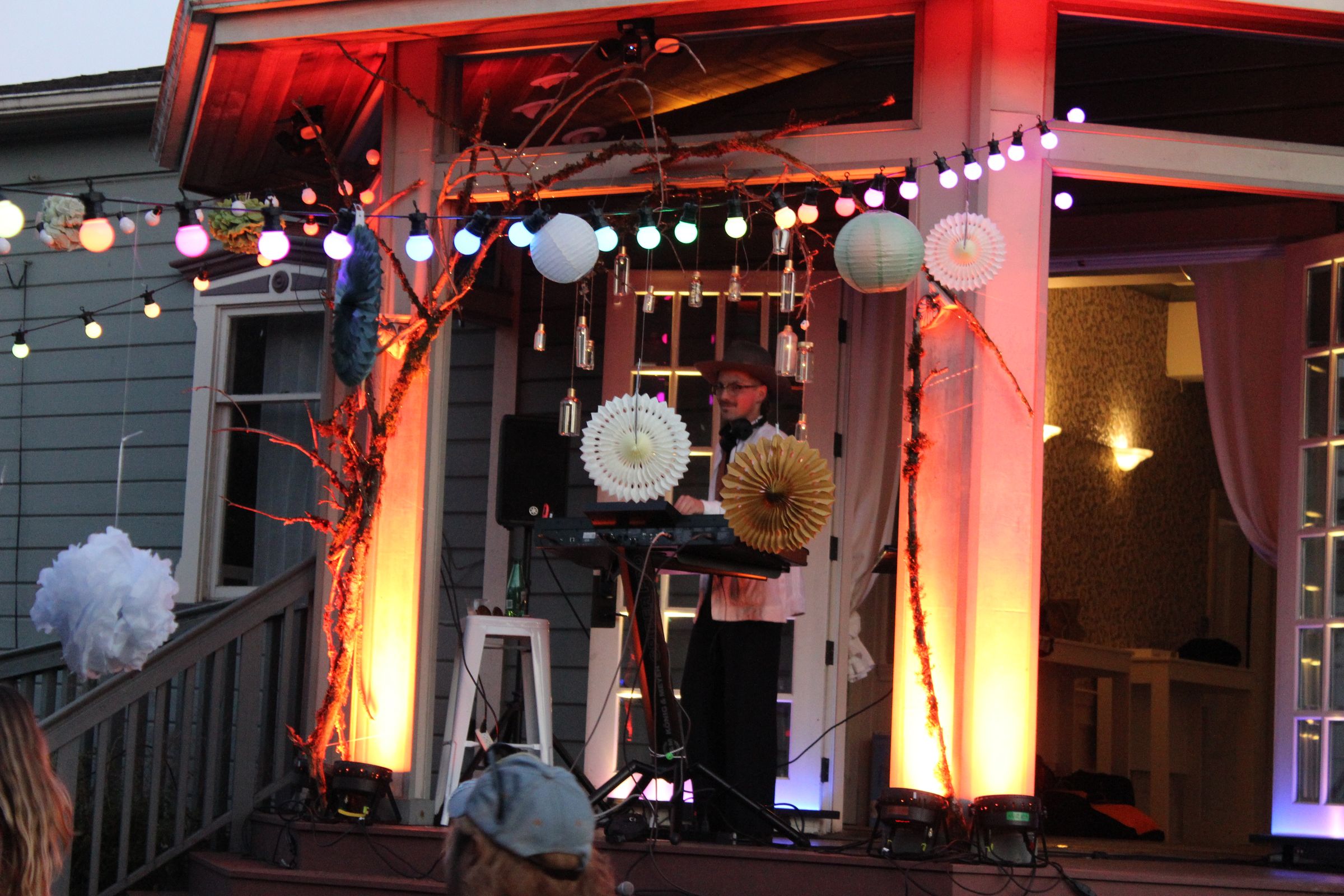the lantern-lit balcony booth at night, styled as a boiler room