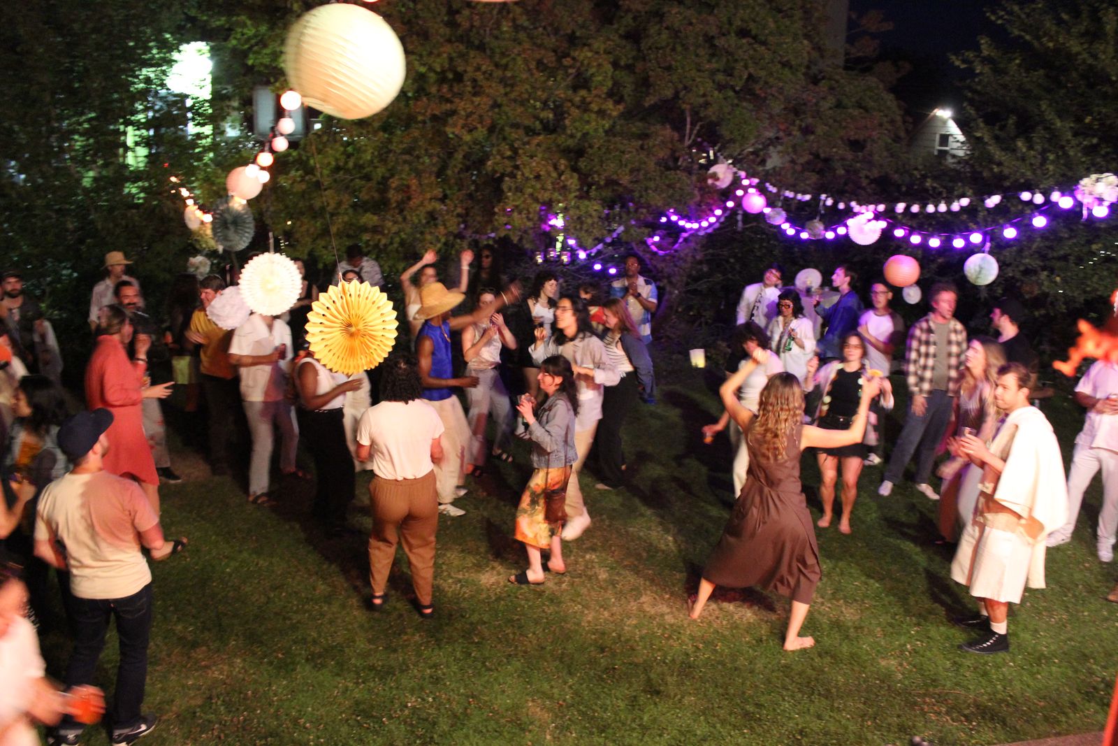 dancing on the lawn under string lights