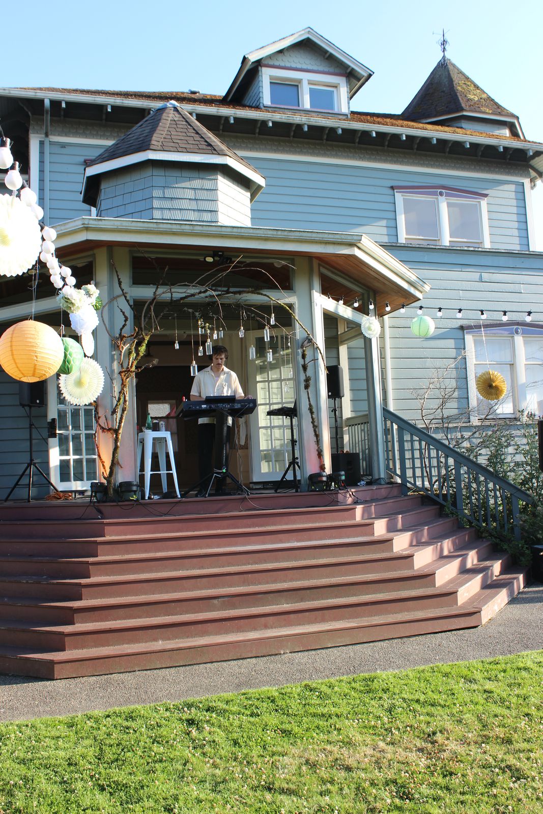 the beacon hill mansion strung with paper lanterns, daytime