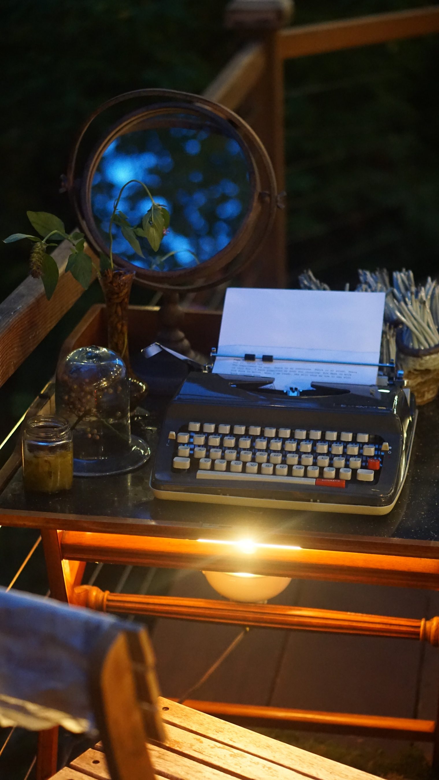 a vintage typewriter on the candlelit field station