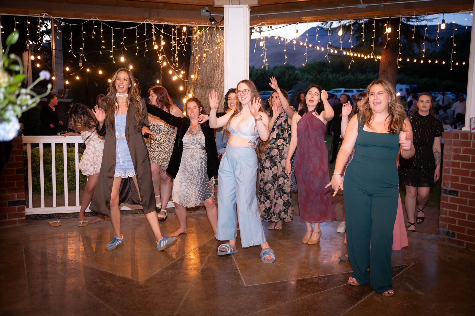 dancing under string lights after dark